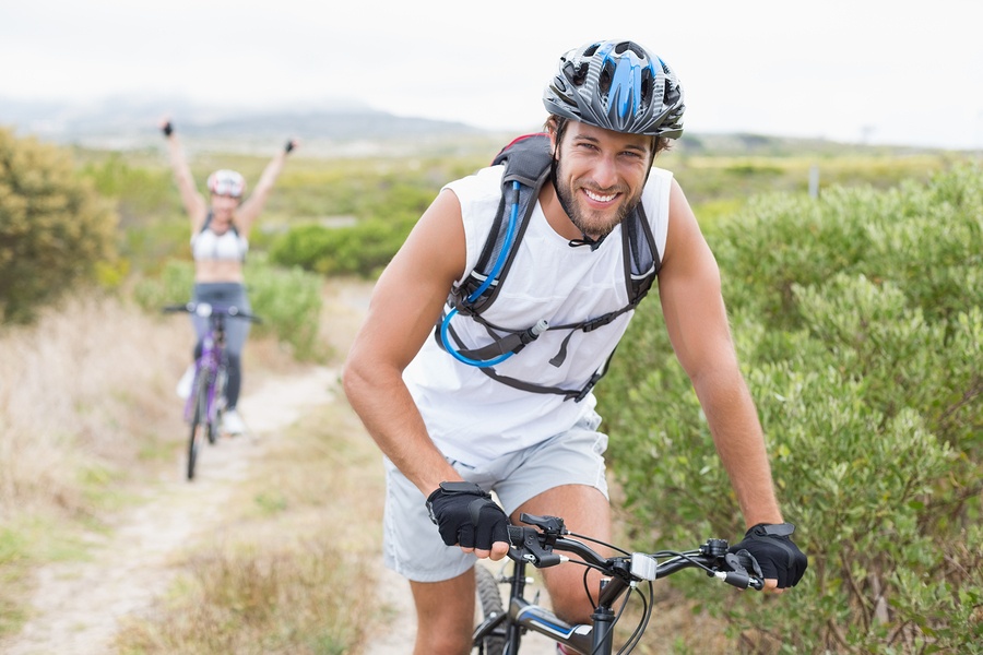 bigstock-Fit-attractive-couple-cycling--69268327.jpg